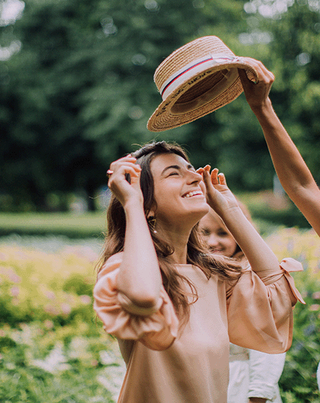 A happy women is having fun with her friends in the garden